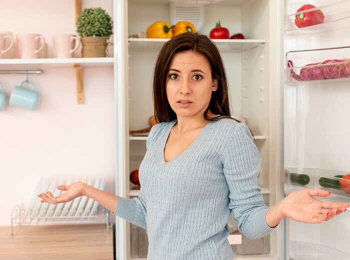 medium-shot-confused-woman-kitchen